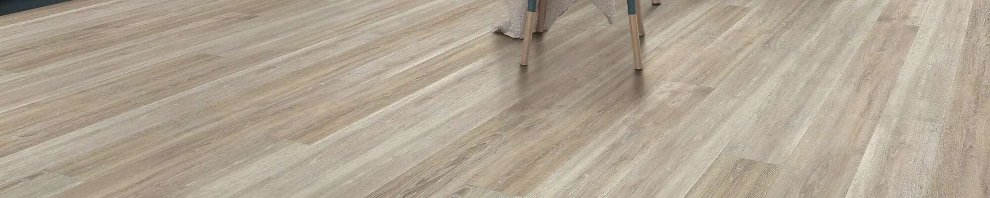 Woman choosing new flooring in the store of Meuth Flooring in Henderson, IN